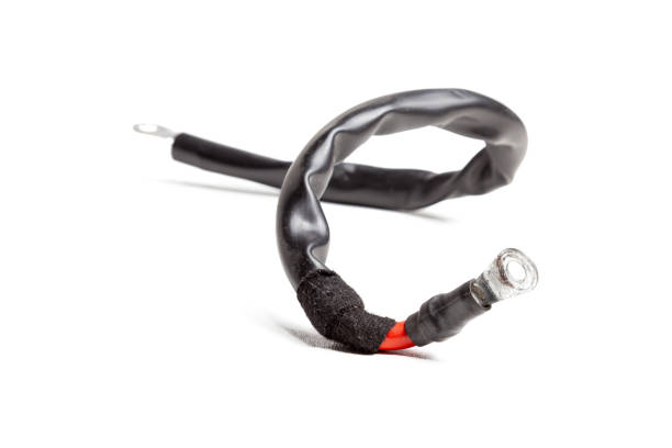 istock Thick short curved red electric wire in black rubber isolation on a white isolated background. Automotive positive terminal. 1216724224