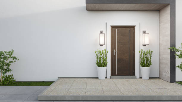 New house with wooden door and empty white wall. 3d rendering of large patio in modern home. facing door stock pictures, royalty-free photos & images