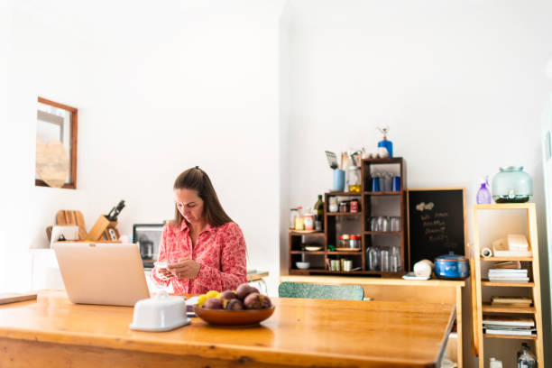 istock Wide shot woman working from home during COVID-19 lockdown 1216730053