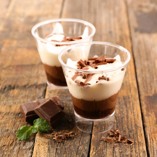 istock chocolate and cream dessert on wood background 1216731299