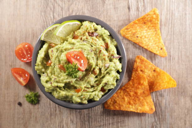 istock guacamole with spicey and tortilla chips 1216731312