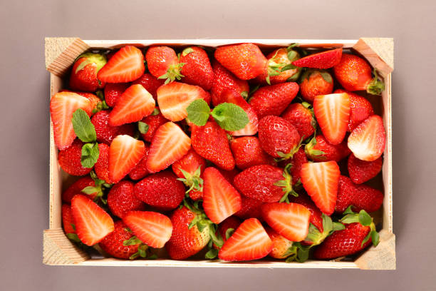 istock wooden box with fresh strawberry- top view 1216731319