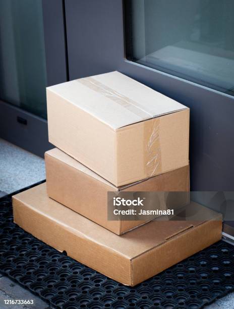 Packages Left At Front Door For Contactless Delivery Stock Photo - Download Image Now