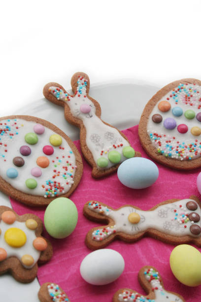 istock Homemade Easter cookies in shape of bunny and Easter eggs on a plate on white 1216735542