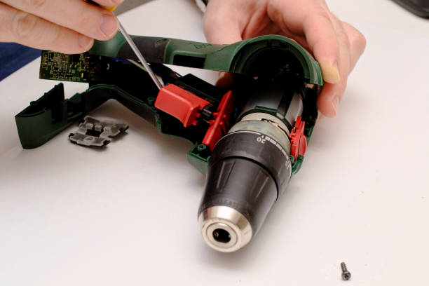 istock Engineer begins repairing a broken screwdriver. opens the case of the screwdriver. 1216736607