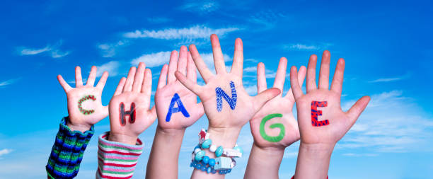 istock Children Hands Building Word Change, Blue Sky 1216736688