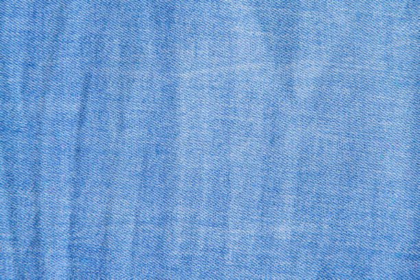 istock denim blue fabric close-up. Textured fabric background. 1216736723