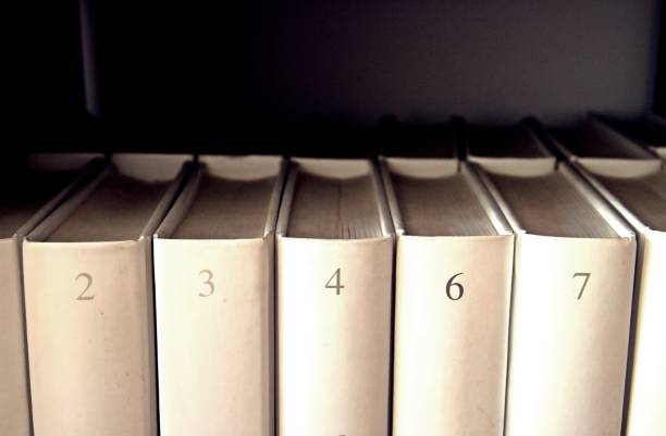istock Numbered books in a bookshelf. 1216737759