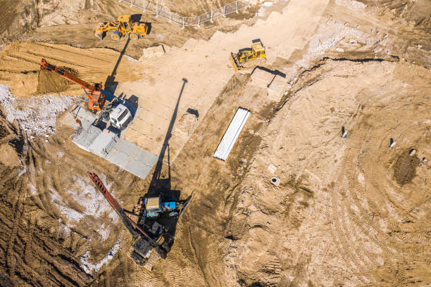 istock heavy construction machinery working in construction site. aerial photo 1216738927