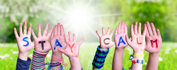 istock Children Hands Building Word Stay Calm, Grass Meadow 1216740256