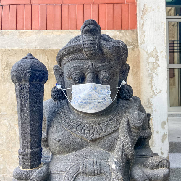 istock Traditional door guardian wearing a mask 1216740723