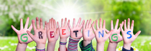 istock Children Hands Building Word Greetings, Grass Meadow 1216740770