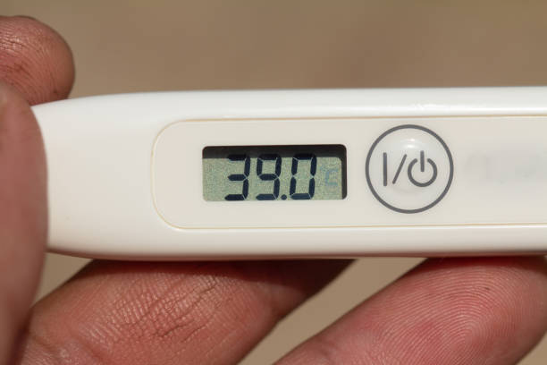 istock Hand-held Medical electronic thermometer. Body Temperature Measurement 39.0 degrees Celsius 1216742034