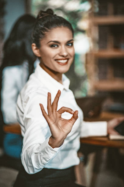 istock Female Office Manager Shows Ok Sign 1216742917