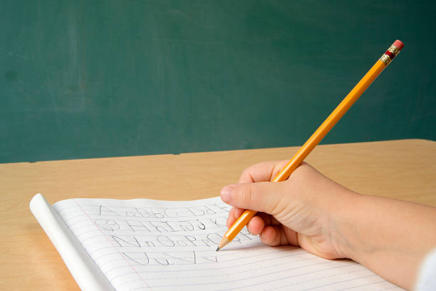 Child Writing the Alphabet