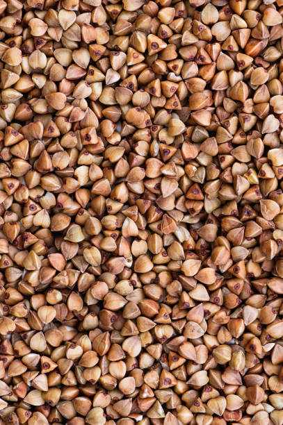 istock Buckwheat groats closeup. Diet concept. Abstract background. 1216747638