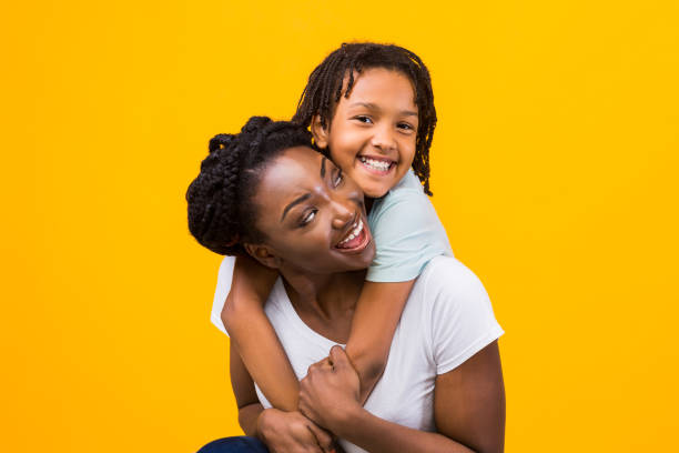 istock Black girl embracing her mom at studio 1216748904