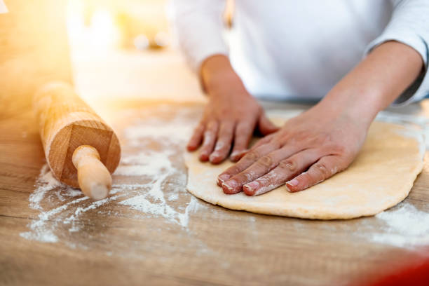 istock Woman kneading dough. Close Up 1216748936