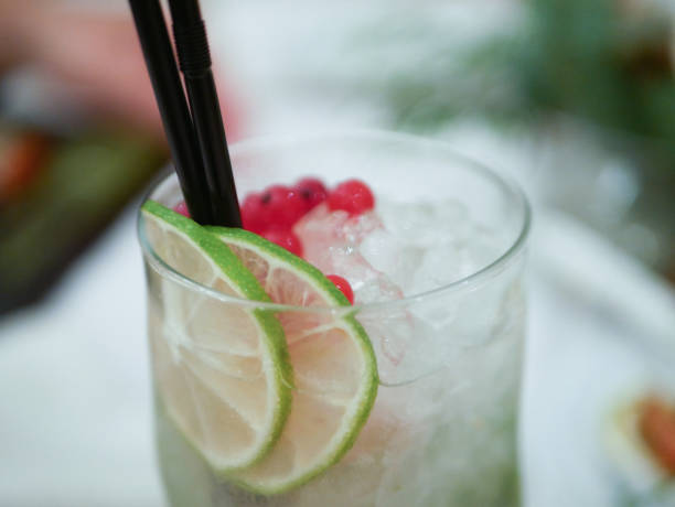 istock Lime cocktail with ice. Fresh smoothie made with ginger beer, lime and ice. Drink on the table 1216750252