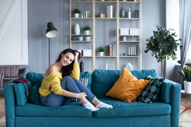 istock Woman on the sofa at home at the weekend. 1216750270