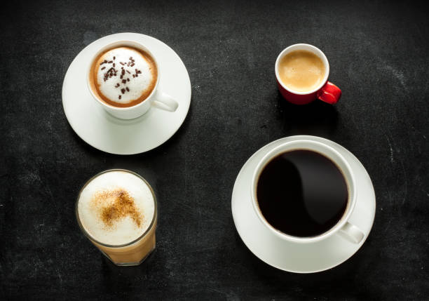 istock Cappuccino, espresso, americano and latte coffee on black 1216751655