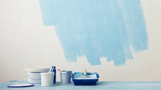 istock Paint in bucket and tray by wall 1216754489