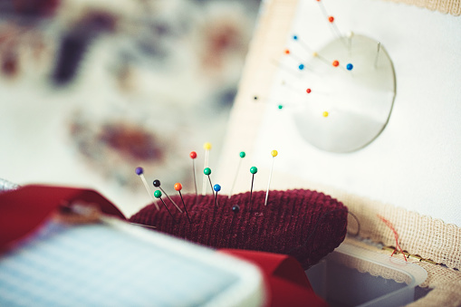 Pins in a pillow in the sewing basket