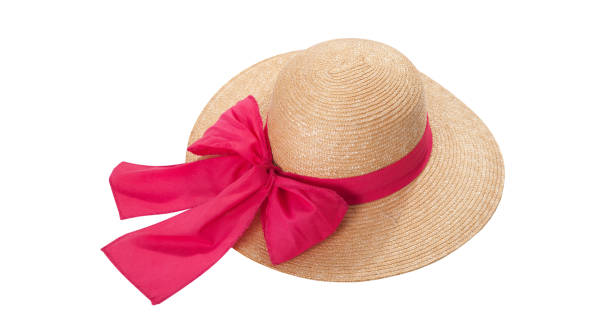 istock Pretty straw hat with ribbon and bow on white background. Beach hat top view isolated 1216758061