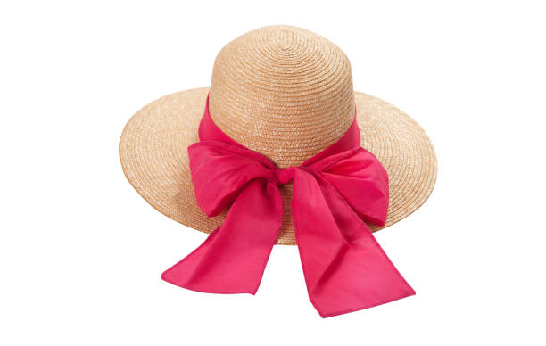 istock Pretty straw hat with ribbon and bow on white background. Beach hat top view isolated 1216758064