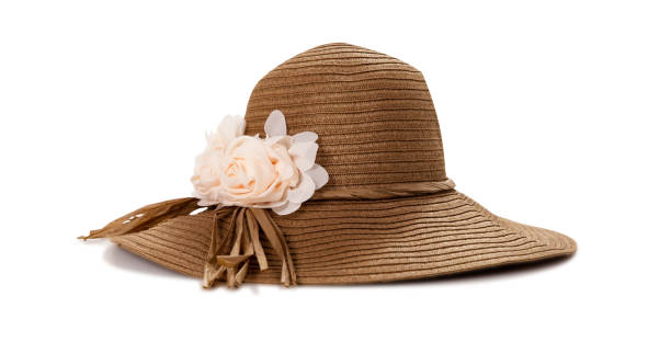 istock Pretty straw hat with ribbon and bow on white background. Beach hat top view isolated 1216758067
