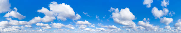 istock Panoramic fluffy cloud in the blue sky. Sky with cloud on a sunny day. 1216758231