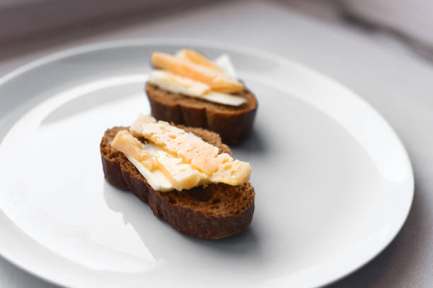 morning sandwiches with coffee. bread with cheese and butter