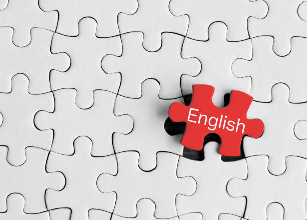 puzzle pieces with word ‘english’ - teaching advice education single word imagens e fotografias de stock