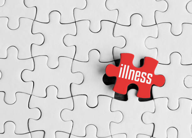 istock Puzzle pieces with word 'illness’ 1216760404