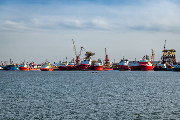 istock Commercial Dock With Containers And Cranes 1216760672