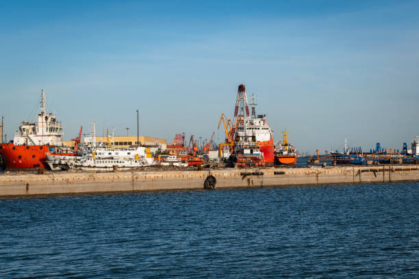 istock Commercial Dock With Containers And Cranes 1216760709