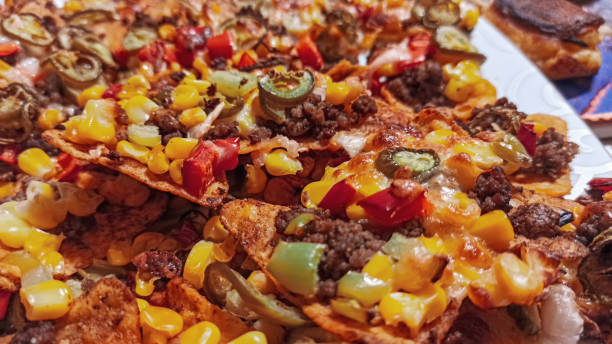 istock Mexican nachos tortilla chips with cheddar and jalapeno. 1216760877