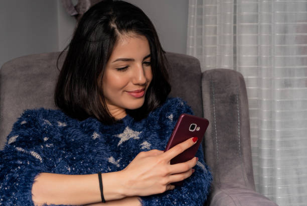 istock Young woman is taking selfie from home during quarantine time 1216763865