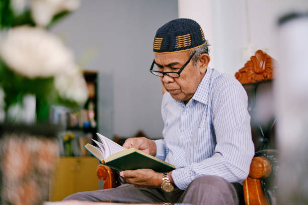 istock Senior Indonesian Man Reading Al-Quran 1216763920