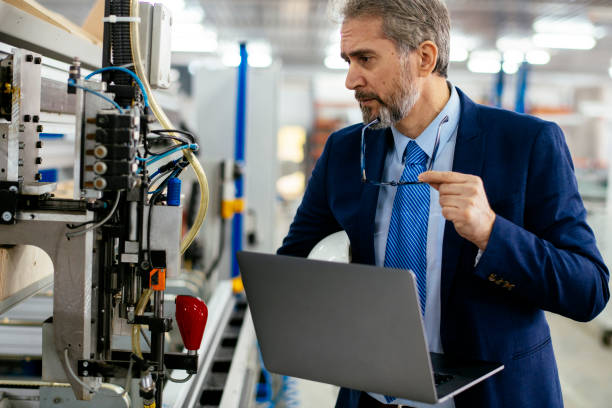 istock Senior engineer in a factory 1216766319