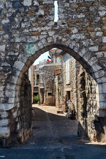 istock A medieval gate in a stone, historic defensive wall 1216769103
