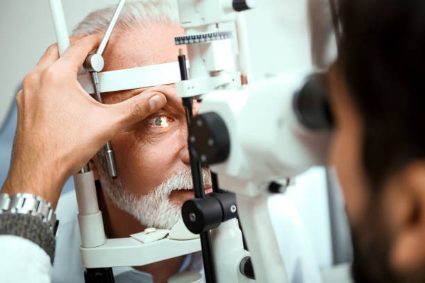 istock Optometrist examining senior mans eyes 1216771836