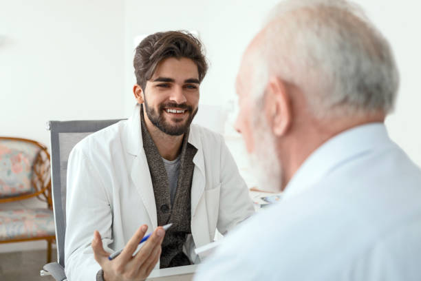 istock Doctor in his office having conversation to a senior man 1216771839