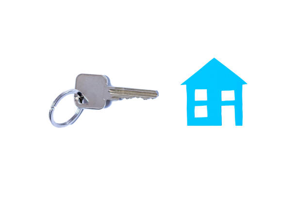 istock A blue house and keys isolated on a white background 1216773052