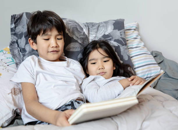 istock child reads a book at home 1216773140