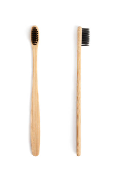 istock Wooden toothbrushes isolated on a white background 1216773969