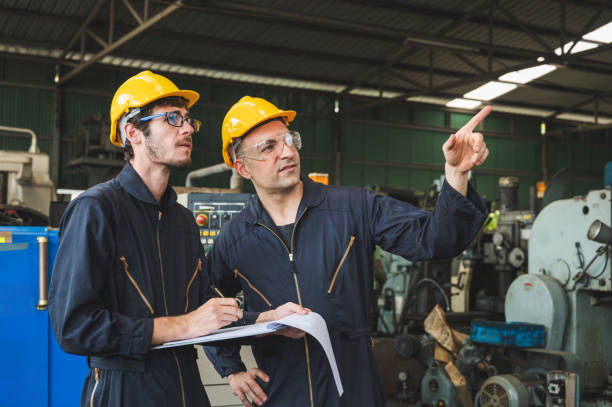 istock Industrial workers are working on projects in large industrial plants with many devices. 1216774921