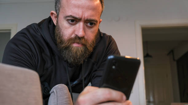 istock Beard Man Checking The News From His Phone 1216776168