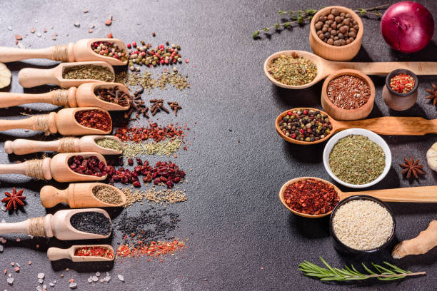 istock Pepper, salt, paprika, basil and other on a dark background 1216778987