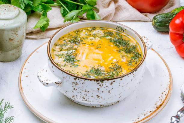 istock Chicken soup bouillon in a plate 1216779046
